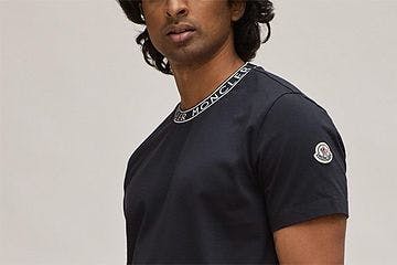 model wearing navy moncler t-shirt
