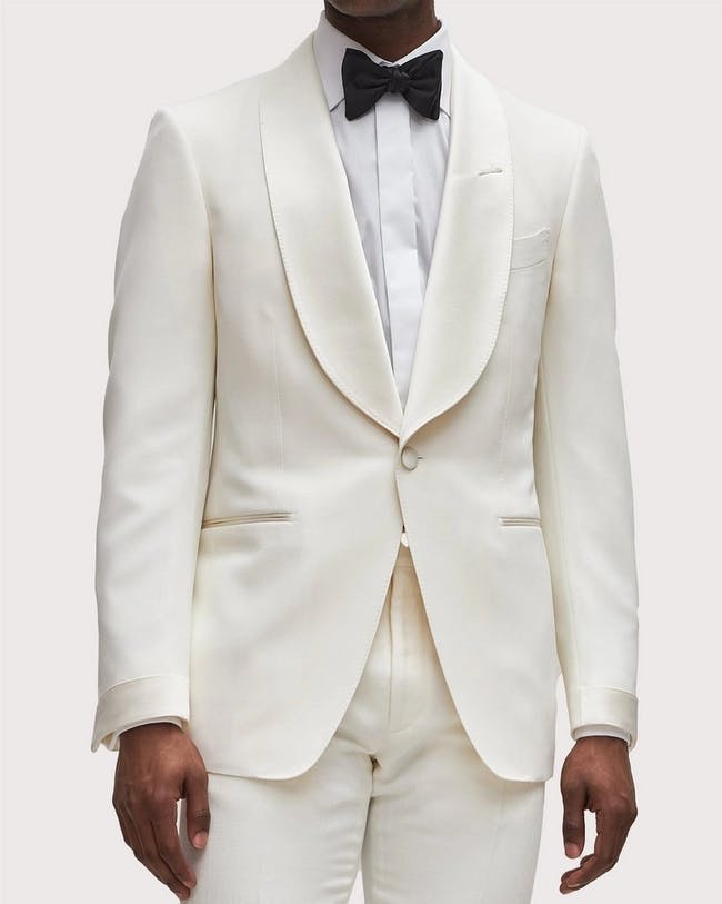 TOM FORD's male model in beige neutral Shelton fit tuxedo jacket with cupro, silk, and mohair.